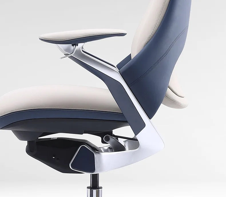 Close-up of a modern office chair showing the backrest, armrest, and seat in navy blue and light beige upholstery with a glossy silver metal frame.