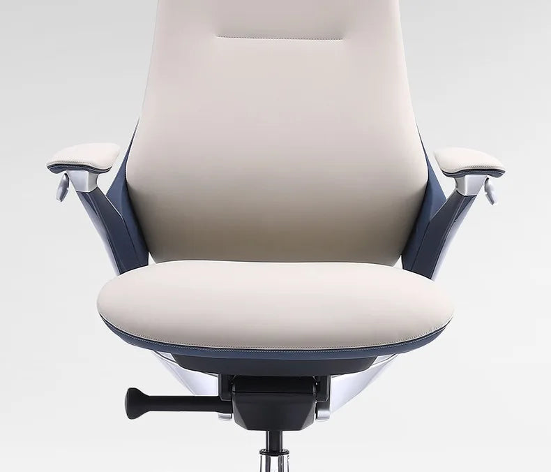 A modern high-back office chair with a cream-colored upholstered seat and backrest, dark navy blue side panels, and silver armrest supports, shown against a light gray background.