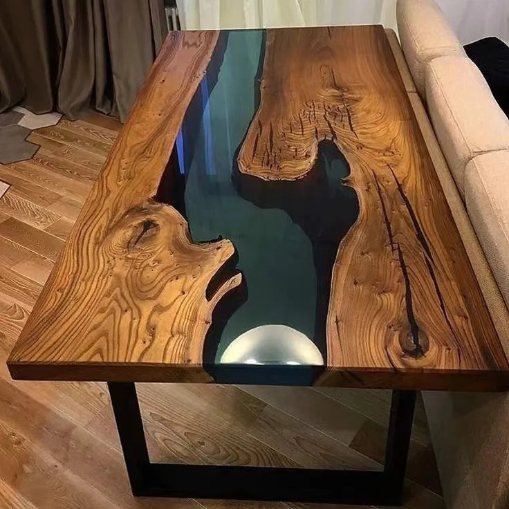 Wooden table with a central green resin flow, placed indoors.