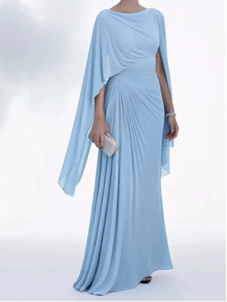 Light blue evening gown with a cape on a white background