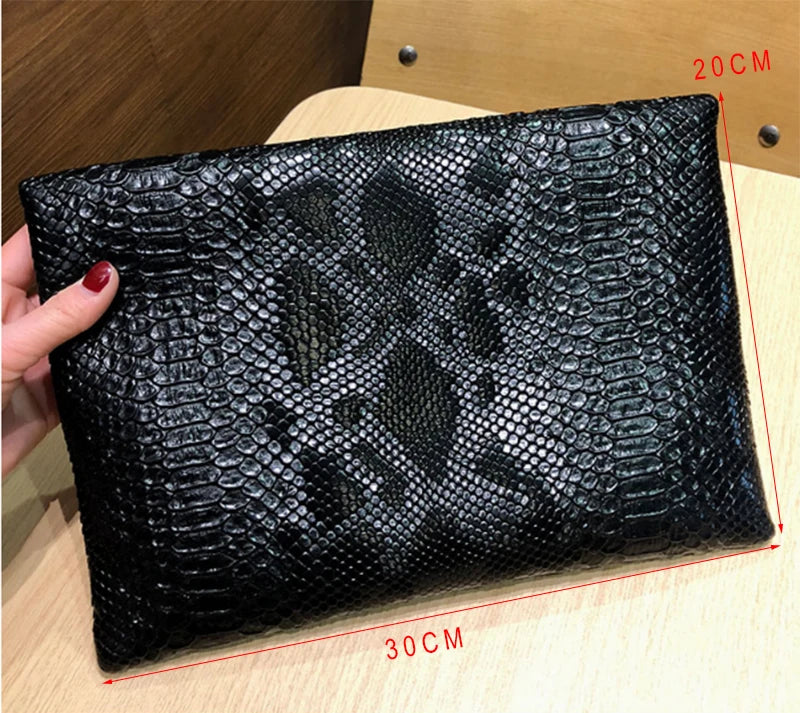 Snake Embossed Leather Clutch Bag — Black | KIMLUD
