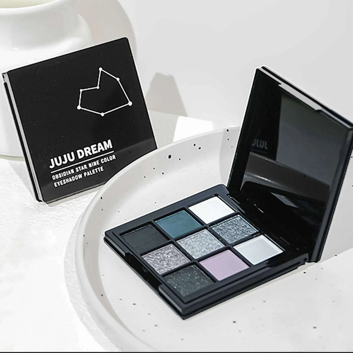 9-shade eyeshadow palette: Black Swan, Smoky, Dark Black, Grey Silver Glitter, Matte Finish, Long-lasting, and easy to color