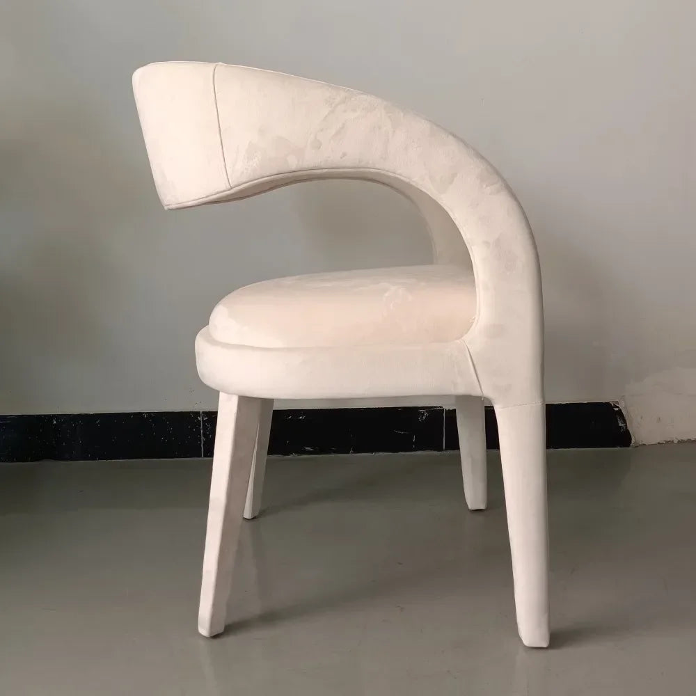 A Nordic minimalist modern designer shaped armchair living room dining room dining chair