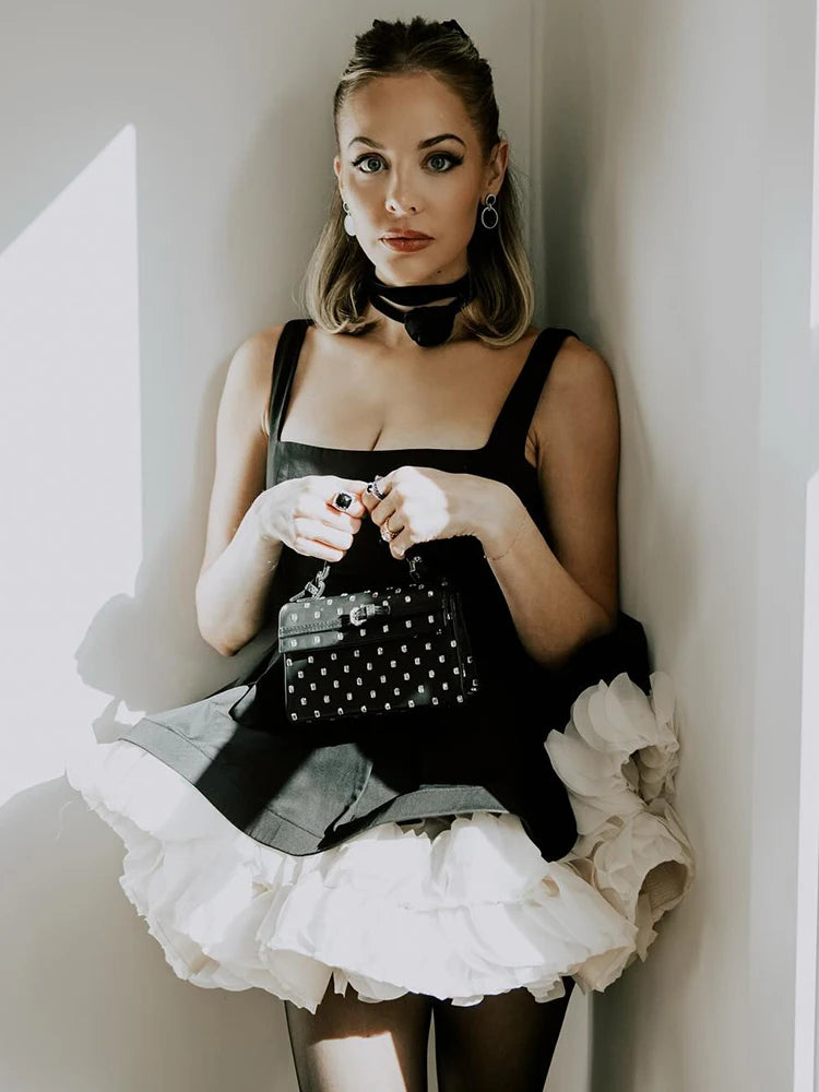 VC Elegant Black Mini Dress with Peplum and White Ruffle Accents for Upscale Casual Gatherings
