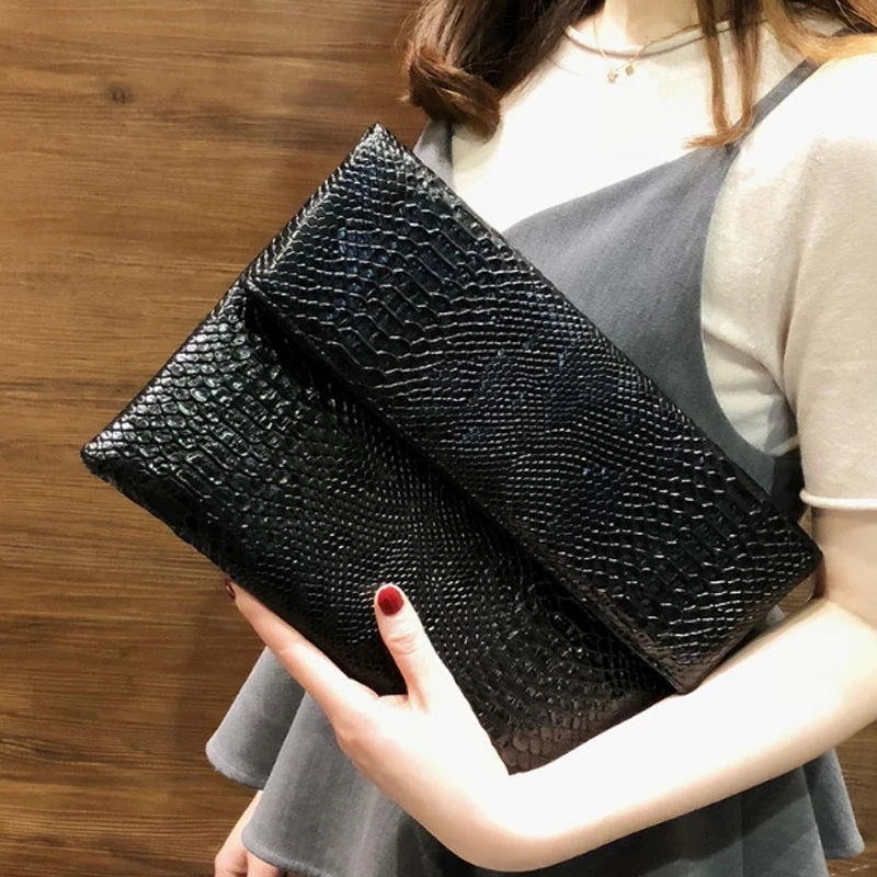 Snake Embossed Leather Clutch Bag — Black | KIMLUD