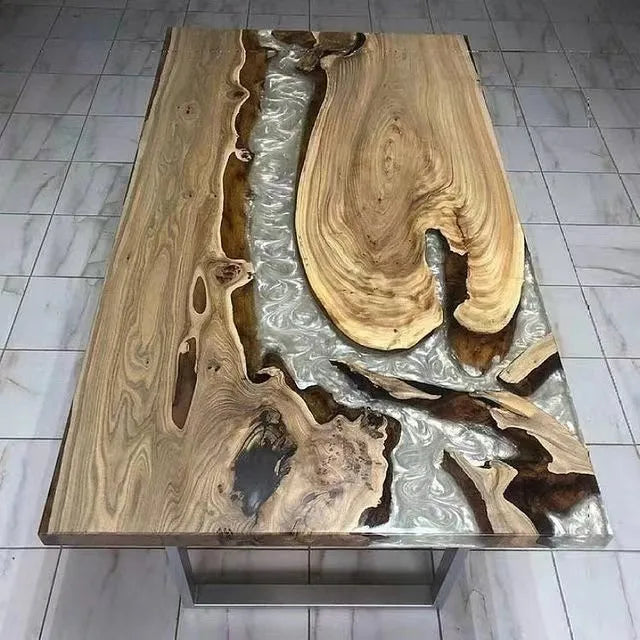 Wooden table with a silver resin inlay on a tiled floor