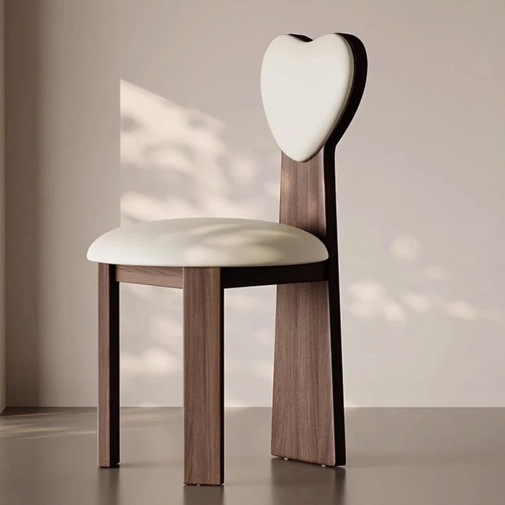 Modern chair with a heart-shaped backrest in a minimalistic setting