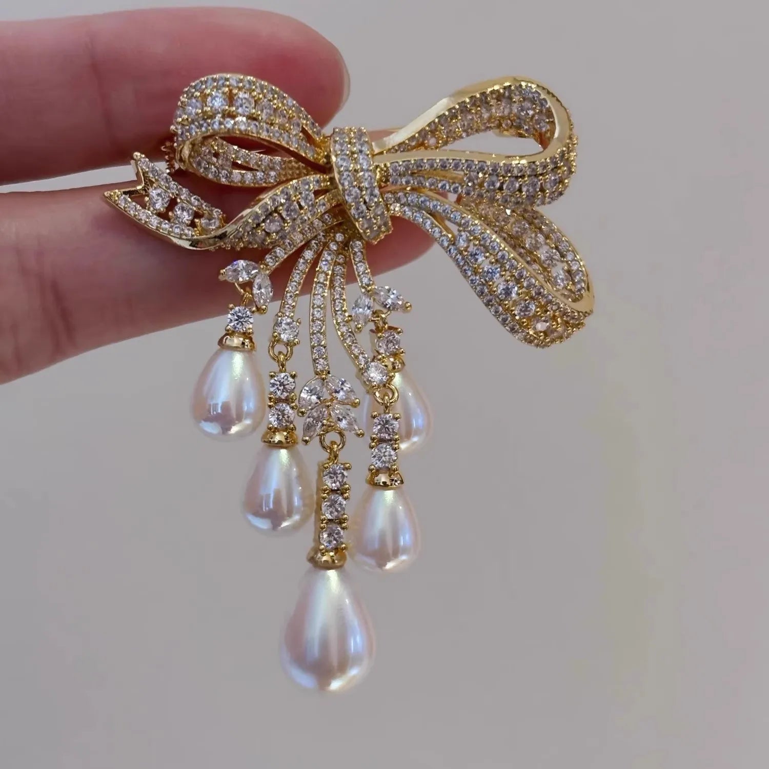 Bowknot Pave Crystal Tassel Brooch — Silver | KIMLUD