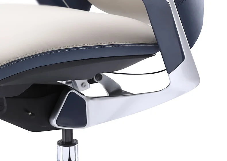 Close-up of a modern office chair showing the backrest, armrest, and seat in navy blue and light beige upholstery with a glossy silver metal frame.
