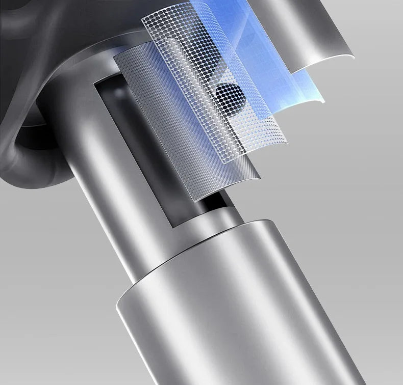 Close-up of a silver vacuum cleaner head with a clear filter on a gray background