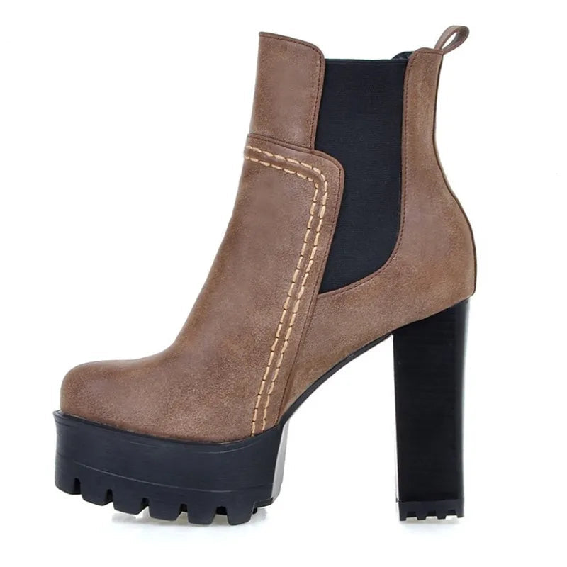 A single brown ankle boot with a chunky black block heel, black platform sole, black elastic side panels, and contrast stitching, shown on a white background with the brand name ZOGEER in the top left corner.