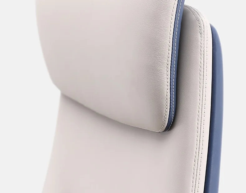 Close-up of a modern office chair showing the backrest, armrest, and seat in navy blue and light beige upholstery with a glossy silver metal frame.