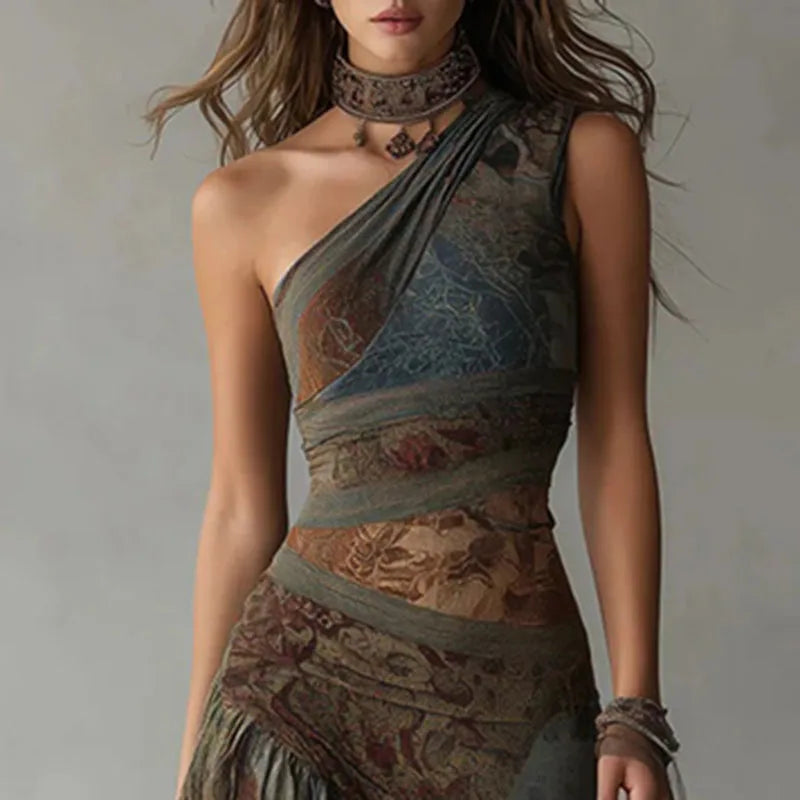 Woman wearing a patterned one-shoulder dress with a neutral background