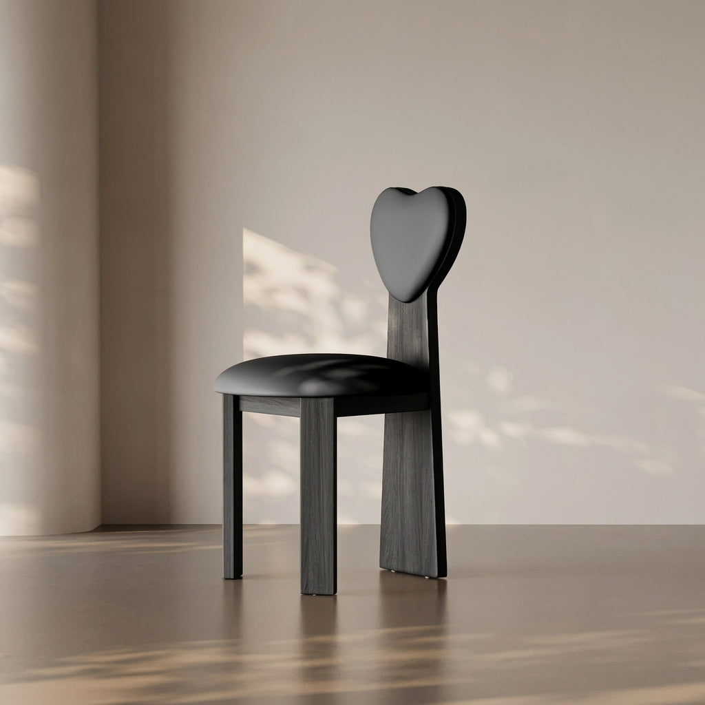 Heart-shaped chair with MEA Chair branding on a neutral background