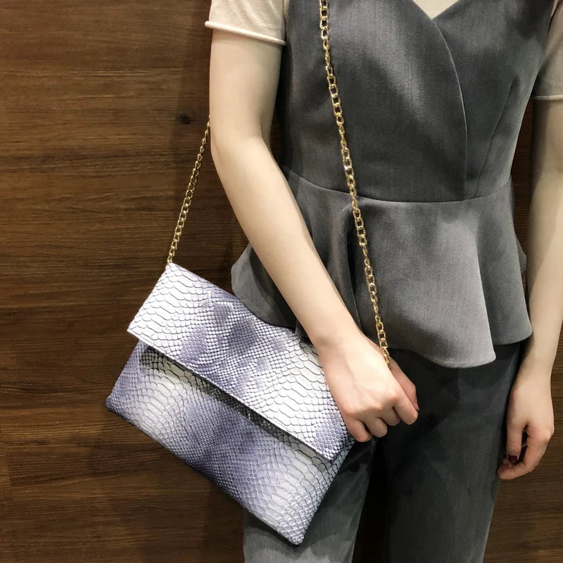 Snake Embossed Leather Clutch Bag — Black | KIMLUD