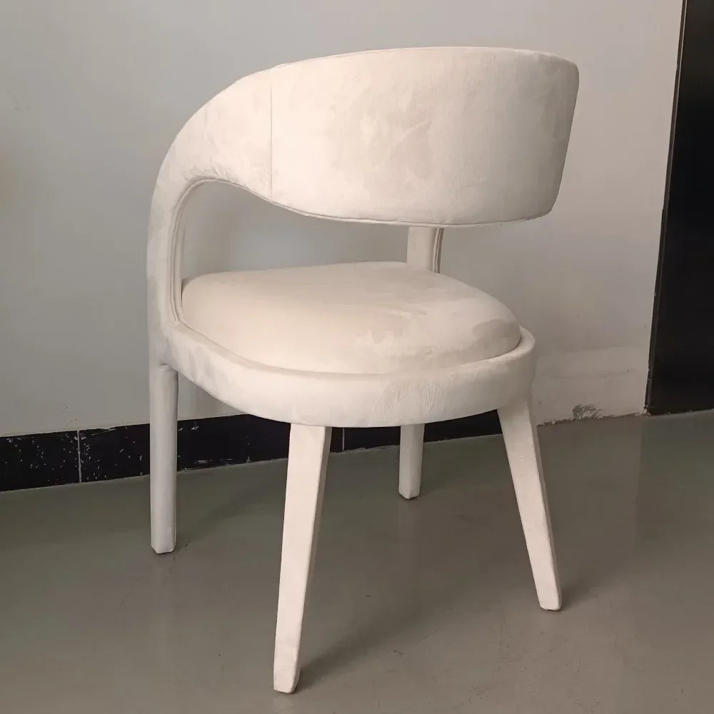 A Nordic minimalist modern designer shaped armchair living room dining room dining chair