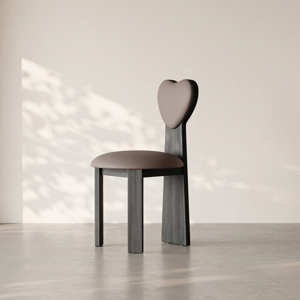 Heart-shaped chair with MEACHAIR branding in a minimalistic setting