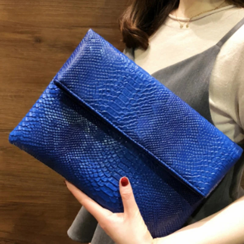 Snake Embossed Leather Clutch Bag — Black | KIMLUD